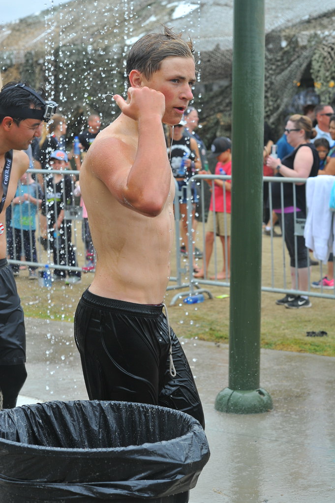 Traces of Mud A young male athlete showers after running t… Flickr