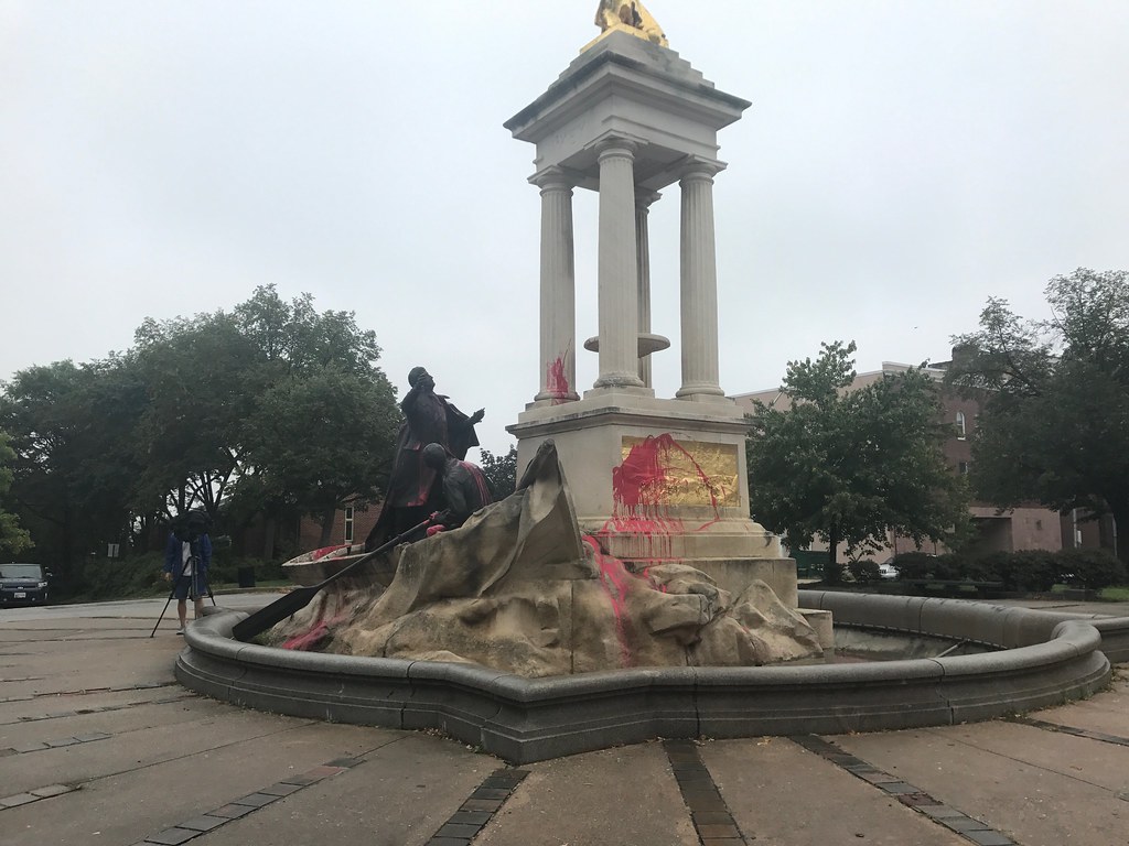 Statue marked with spray paint graffiti and splashed red p… Flickr