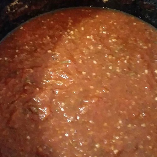 Cooking homemade pizza sauce from our homegrown plum tomat… Flickr