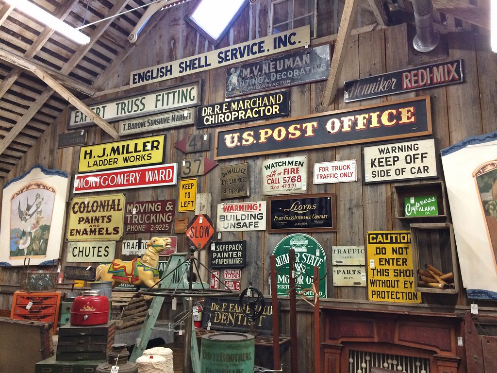 Aurora Mills architectural salvage Gallery wall of old sig… Flickr