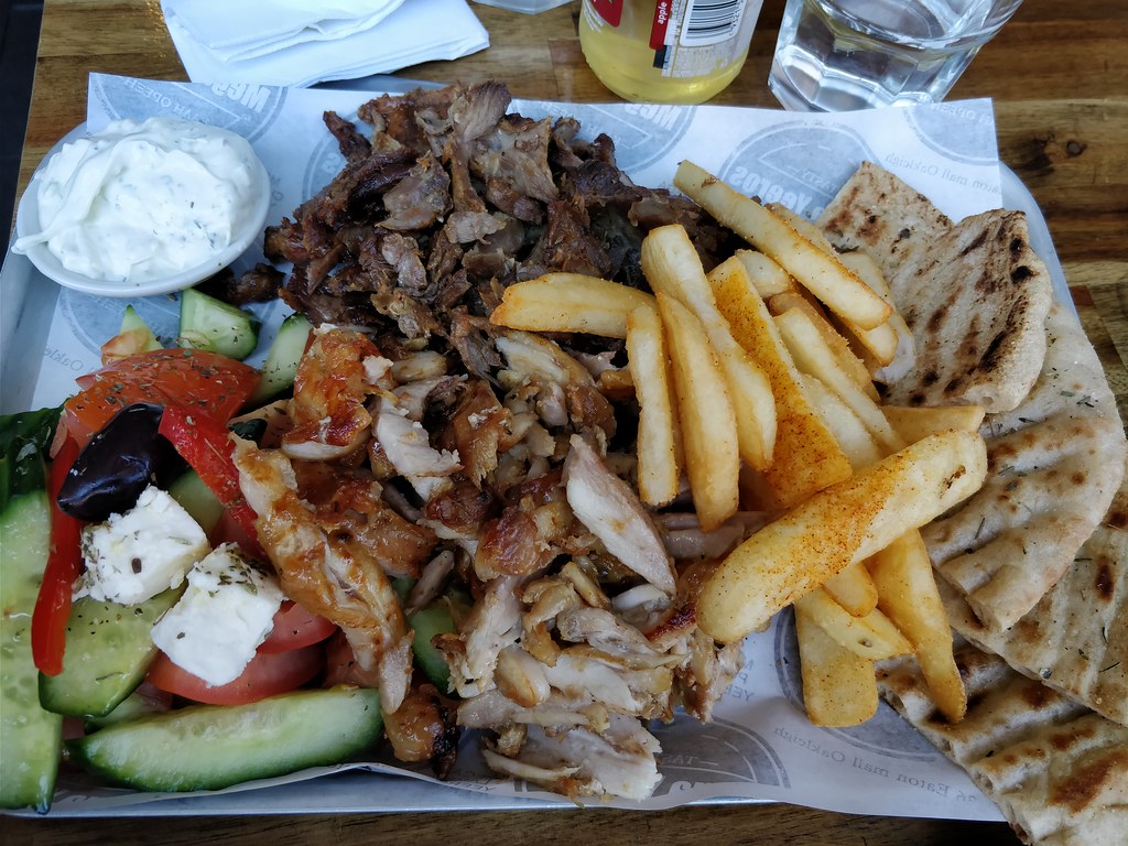 Mixed lamb and chicken gyros, pita, salad, chips, tzatziki… Flickr