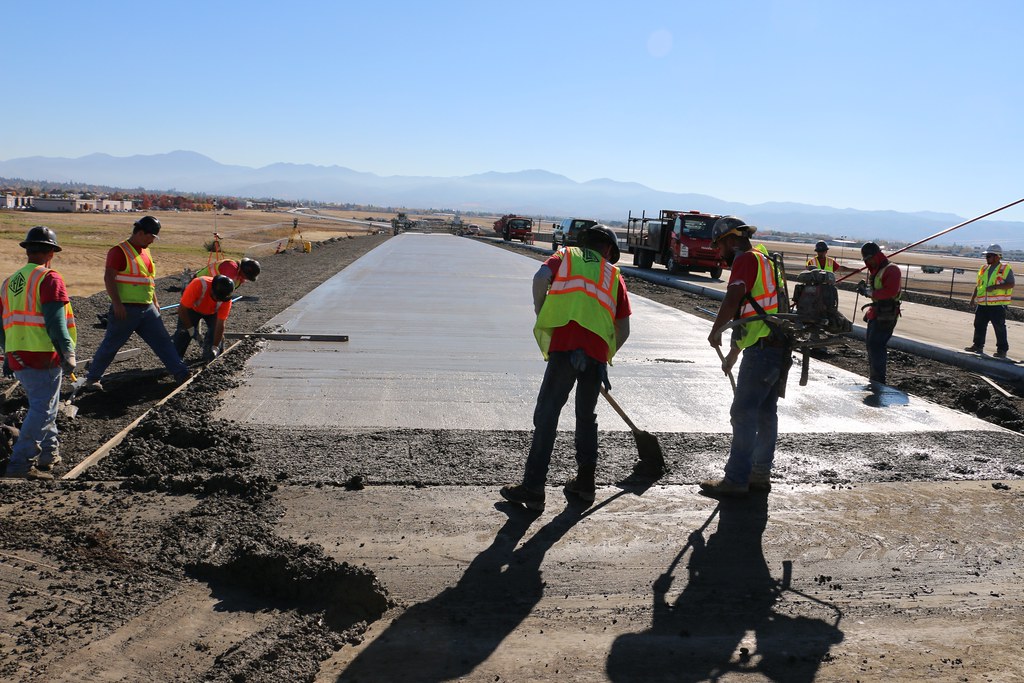 Concrete finishers work a bridge joint. Crews from Roger L… Flickr