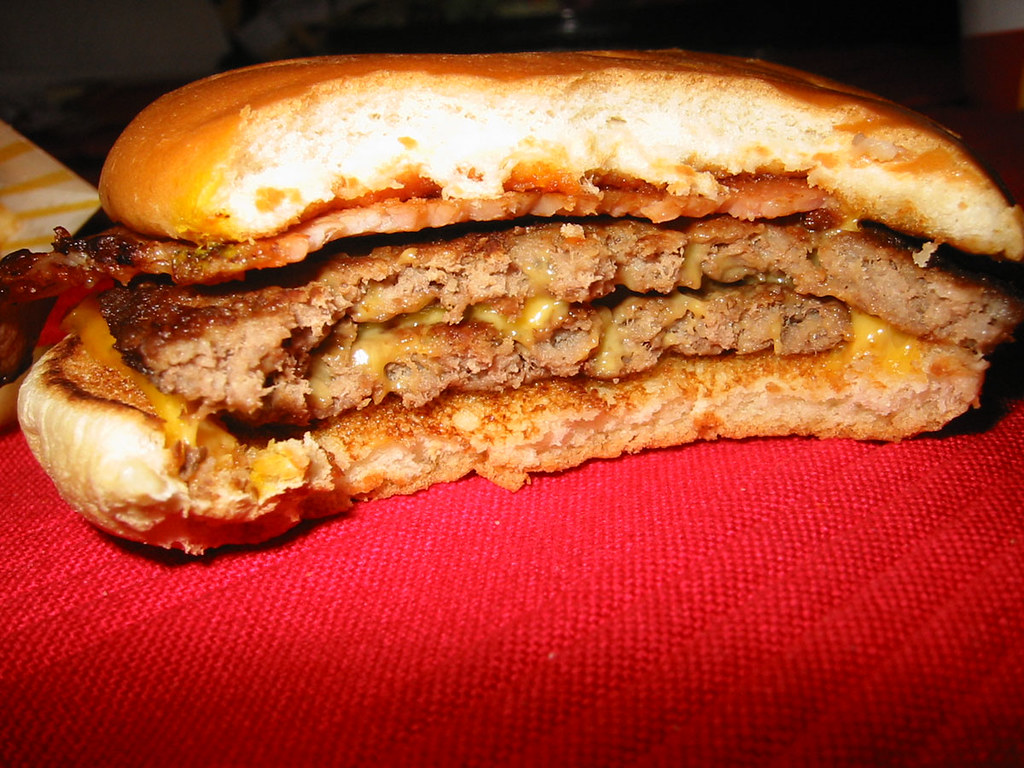 McDonald's double cheeseburger with bacon half gone Flickr