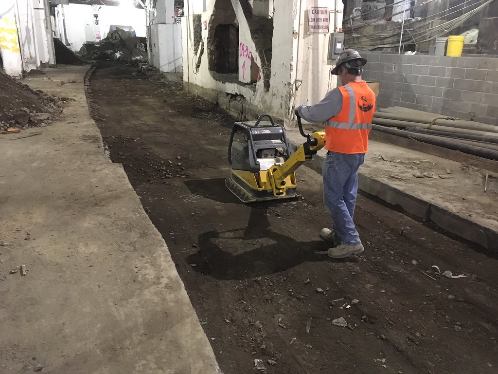 Tamping down backfill over a utility trench in the future … Flickr