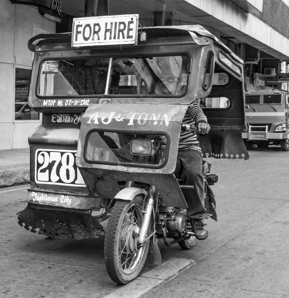 AJ & Tonn's Tricycle Tricycle driver moving along the main… Flickr