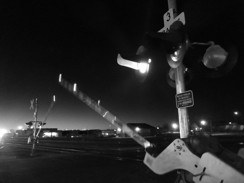 Approaching train with gates Gallup, NM P1260934 John Cocanower