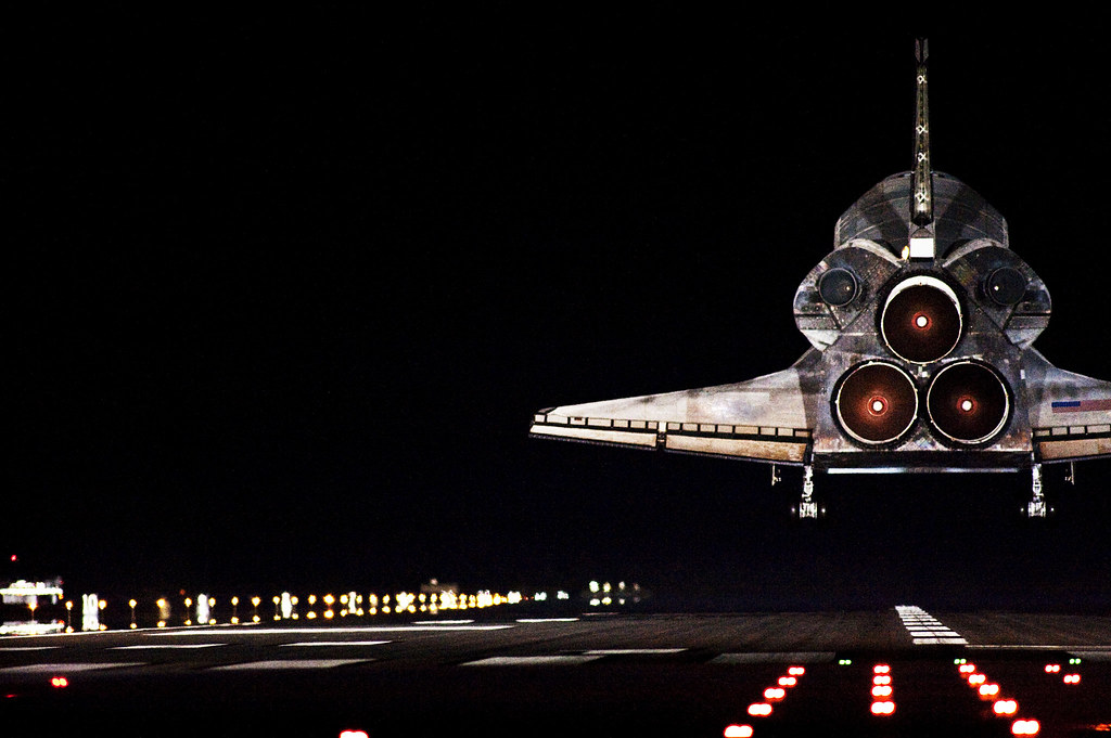Space shuttle Endeavour lands in darkness on Runway 15 at the Shuttle Landing Facility at NASA's