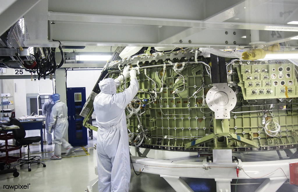 A Lockheed Martin technician performs tube welding on the Orion crew