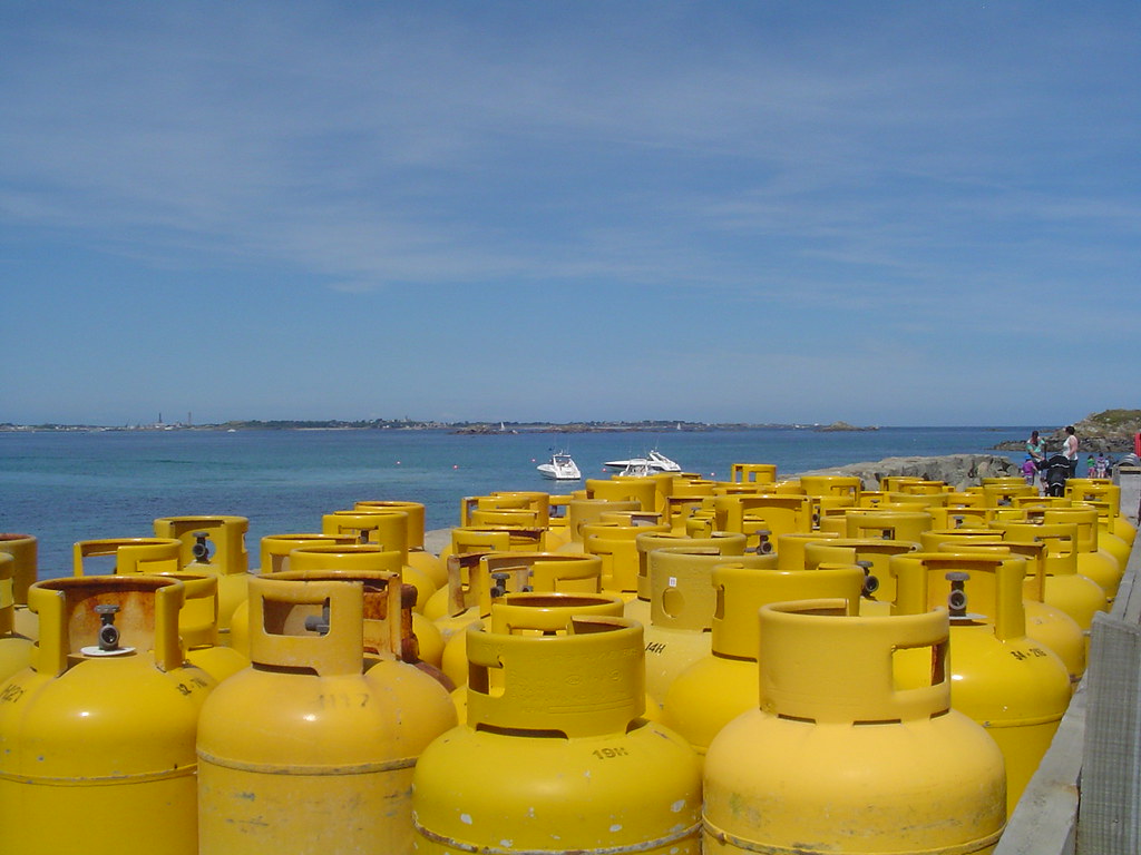 Blue & Yellow Gas bottles awaiting ferry on Isle of Herm C… Flickr