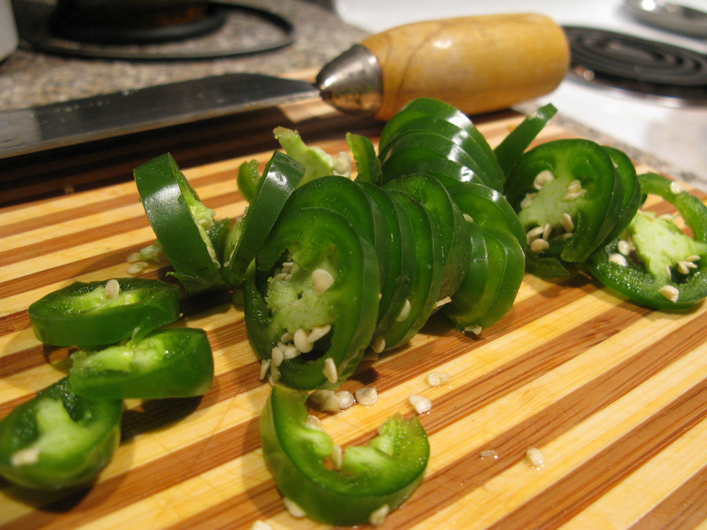 chopped jalapeno peppers Chopped jalapeno pepper on a cutt… Flickr