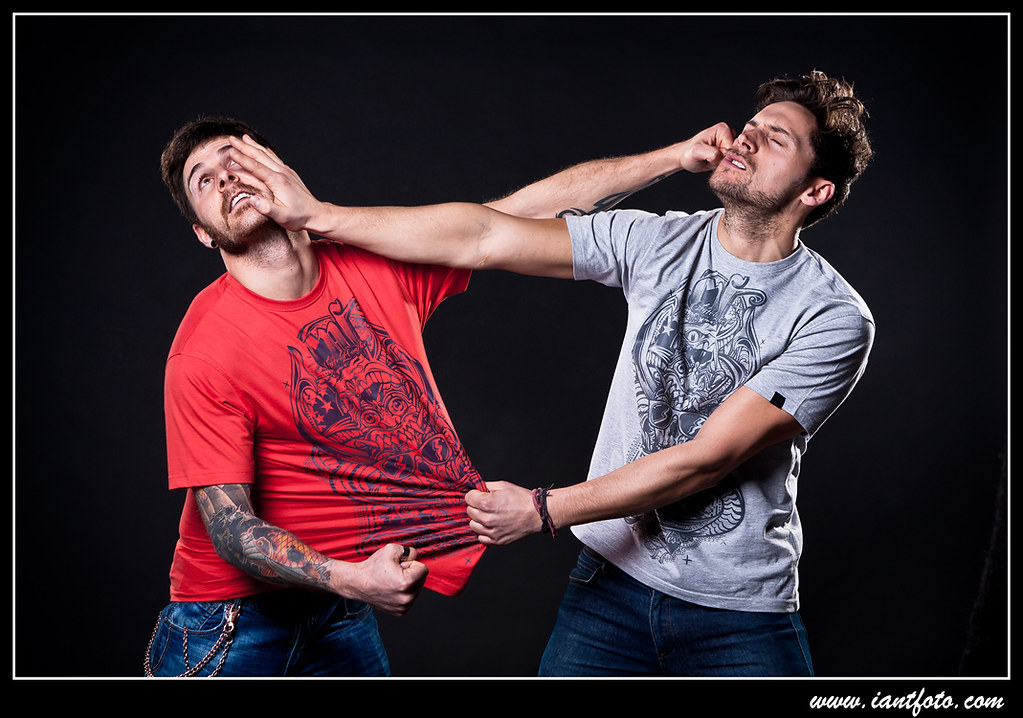 Two guys fighting. Two guys fighting, over black backgroun… Flickr