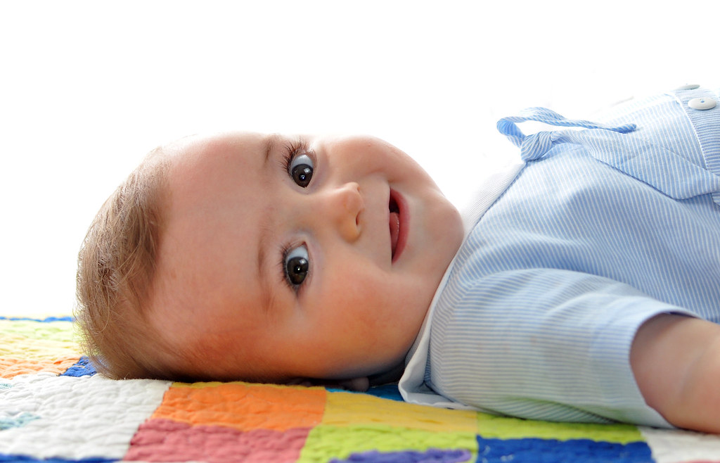 Baby laying down Background lit with an SB28, baby lit