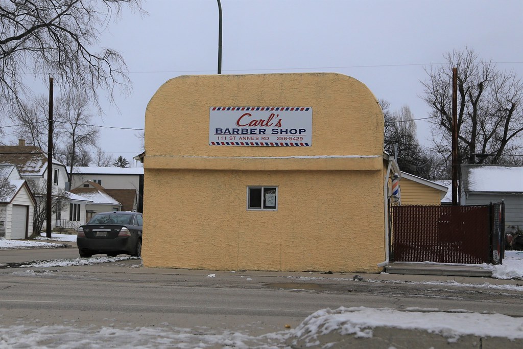 Carl's Barber Shop This side of the odd looking building i… Flickr