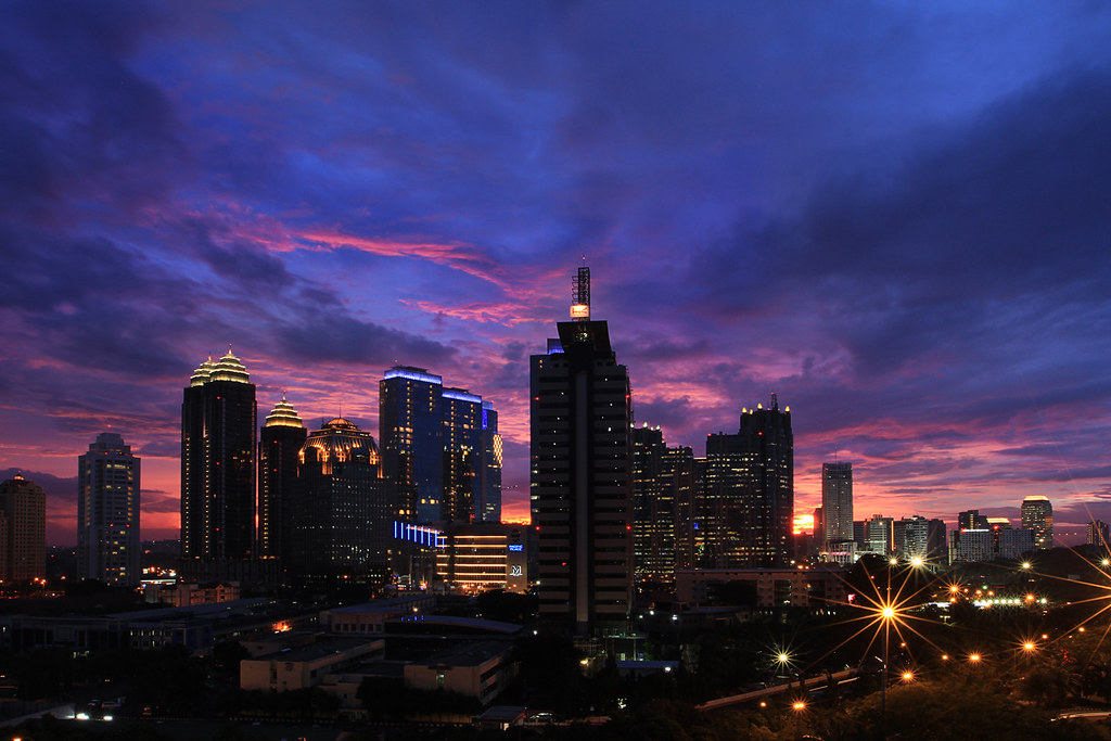 Jakarta under the sunset sky Jakarta cityscape at sunset, … Flickr