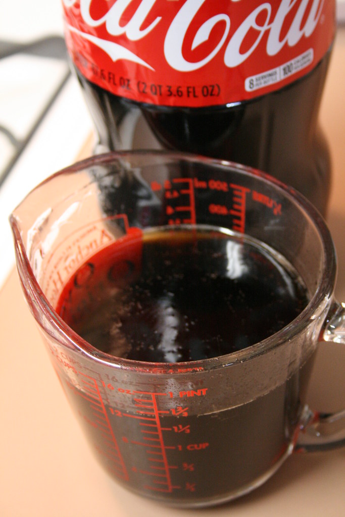 Measuring the CocaCola and cherry syrup. Nicole Cleghorn Flickr