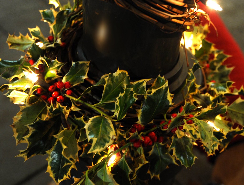 Holly decoration around a pole with merry Christmas lights, Seattle