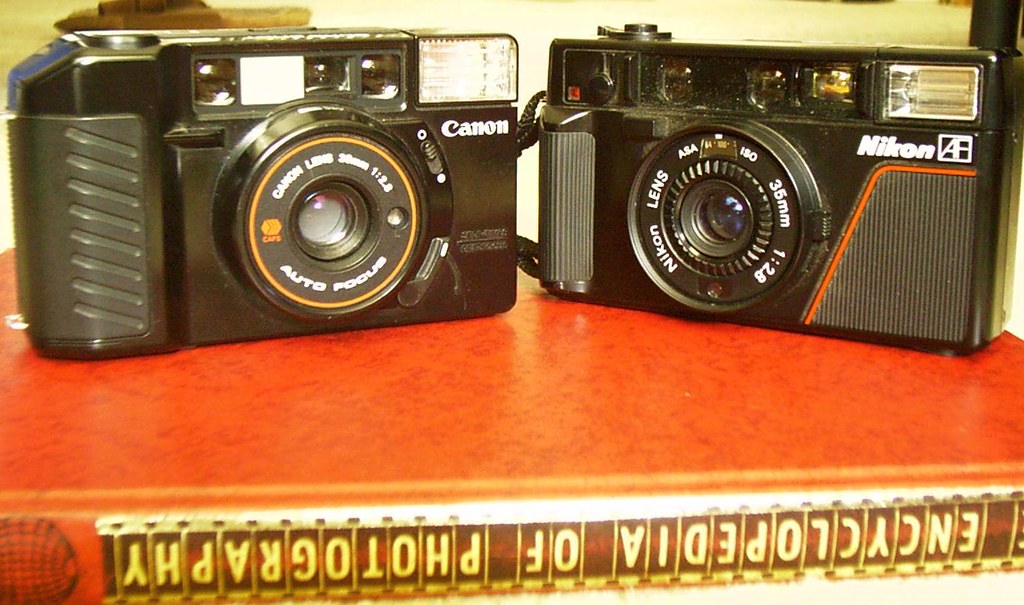 Nikon & Canon Compacts Canon Sure Shot and Nikon L35AF are… Flickr
