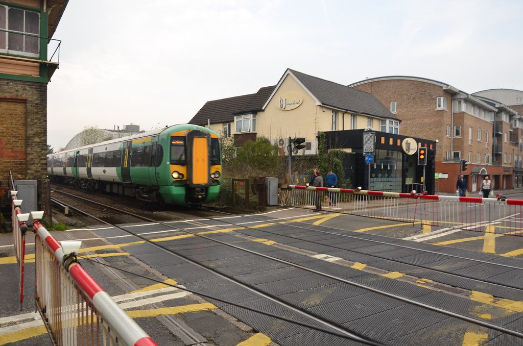 Train at level crossing at Crawley station a photo on Flickriver