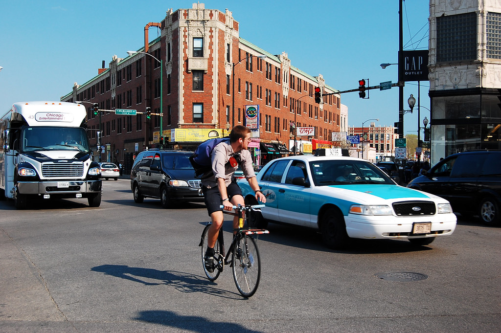 biker in traffic on Milwaukee (Chicagoland Bike & Walk Pho… Flickr
