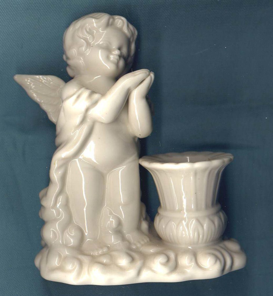 angel candle holder white White ceramic candle holder with… Flickr