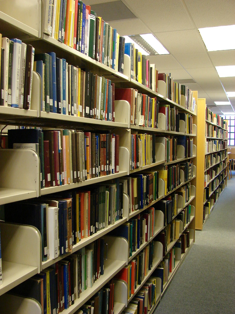 Books on shelves in the library Off to the library to look… Flickr