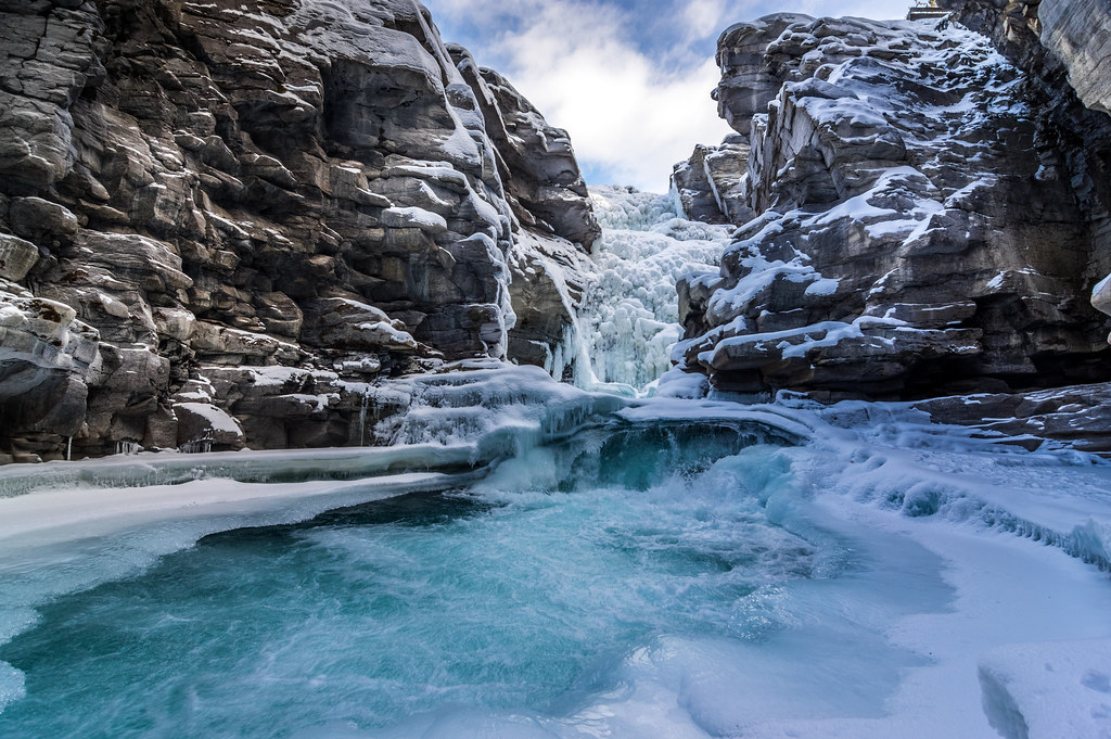 Athabasca Winter Frozen Athabasca Falls, tall canyon walls… Don