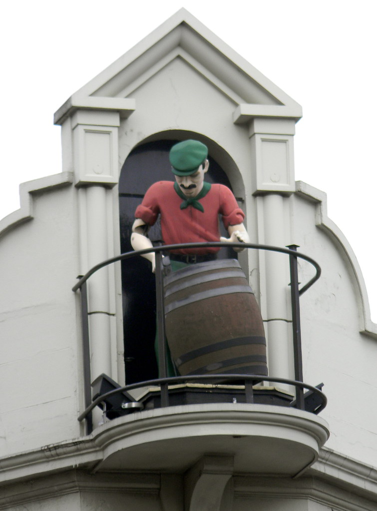 Statue of man with beer barrel on building Charing Cross R… Flickr