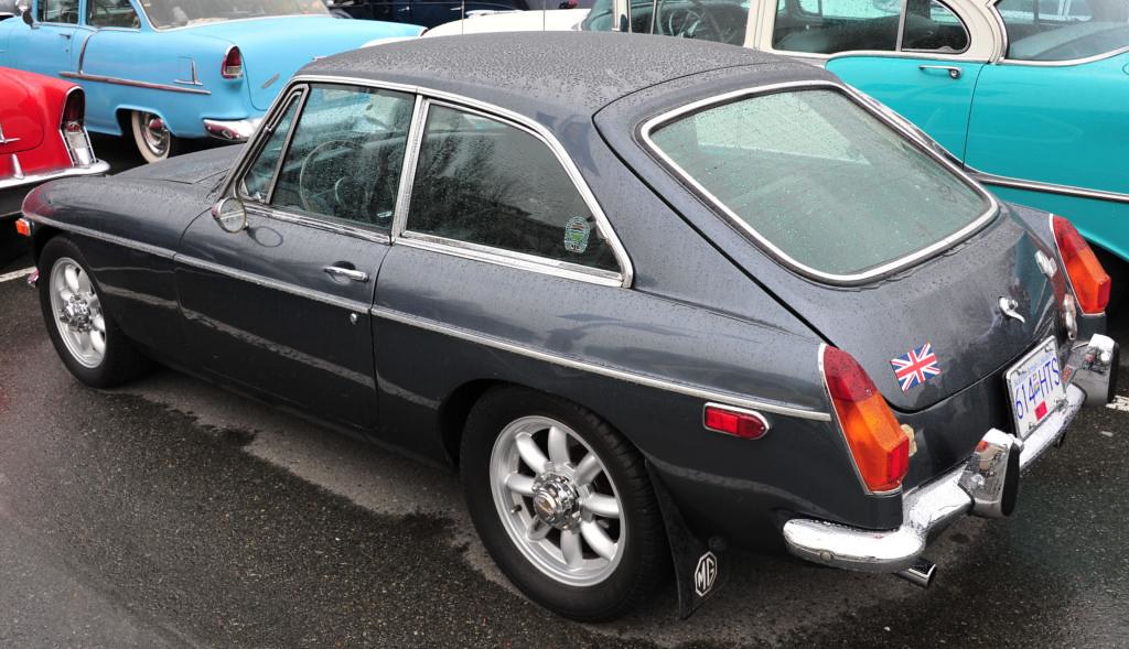 MGB GT One handsome coupe with a Union Jack flag on the ha… Flickr