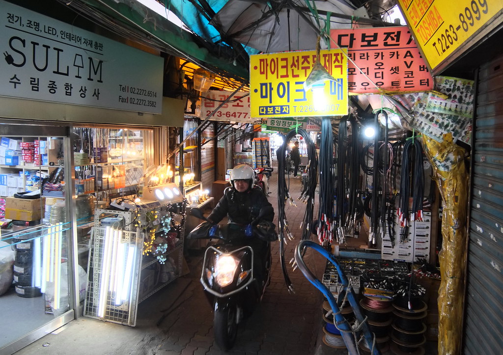 Seoul Korea Seun Electronics market backalley sporting lots of wires and some transport "That