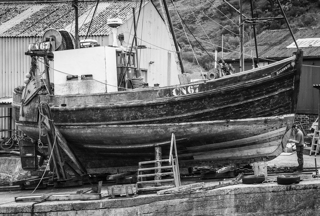 Boat repair at Mallaig A fellow working on a boat at Malla… Flickr