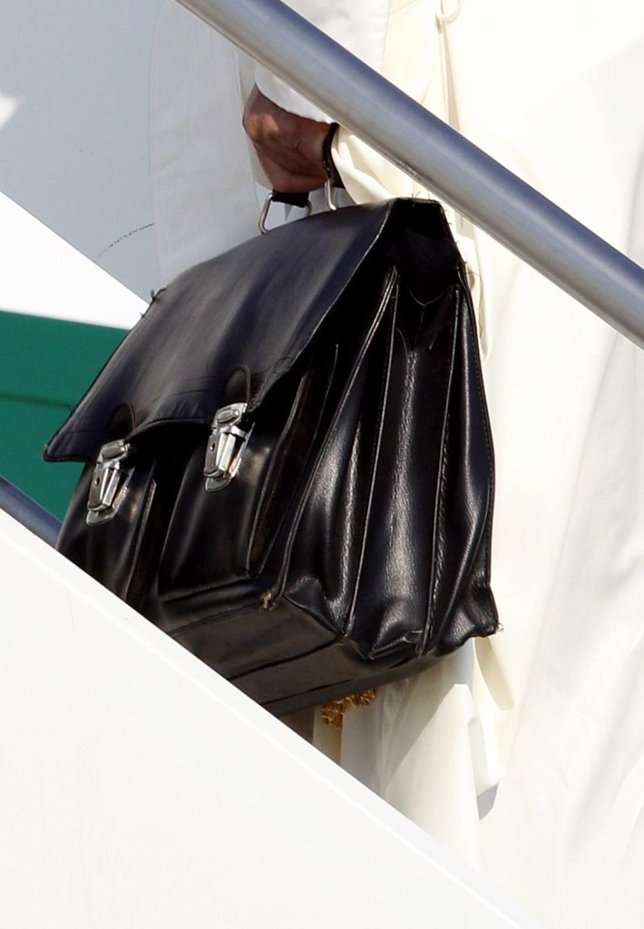 Vatican Pope Departure Pope Francis holds a bag as he boar… Flickr