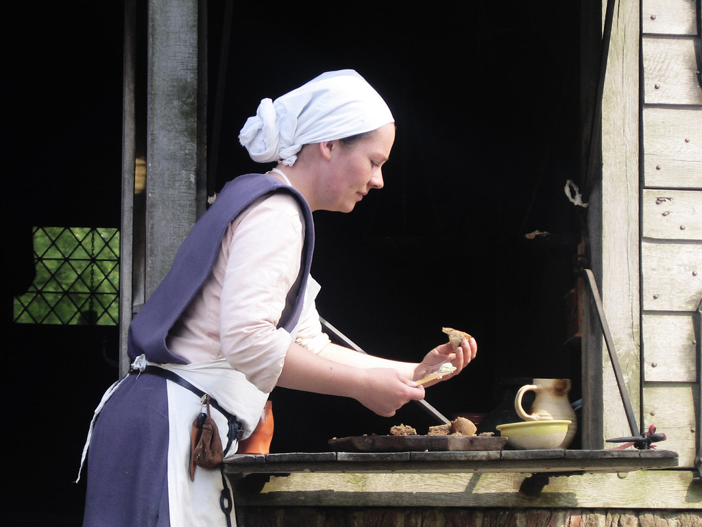 medieval baker tasting some of her own bread Hans Splinter Flickr