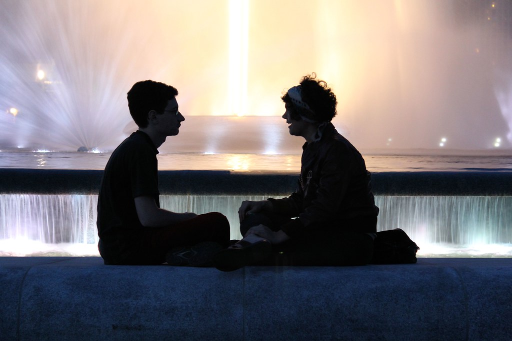 fountain talk two people deep in conversation caught my at… Flickr