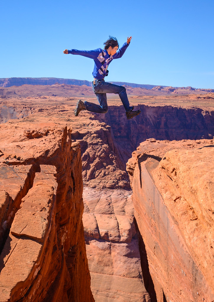 Jump! Me jumping over a cliff at horseshoe band, Utah Yumian Deng
