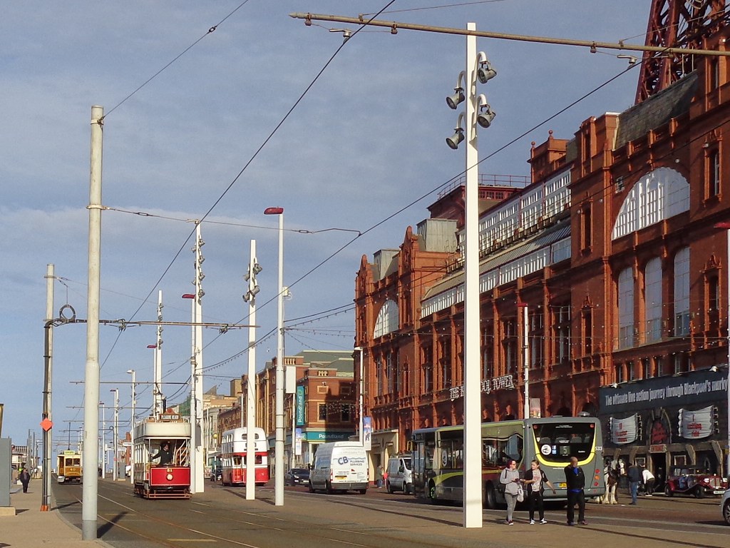 Old and new buses and trams passing Blackpool Tower in ear… Flickr