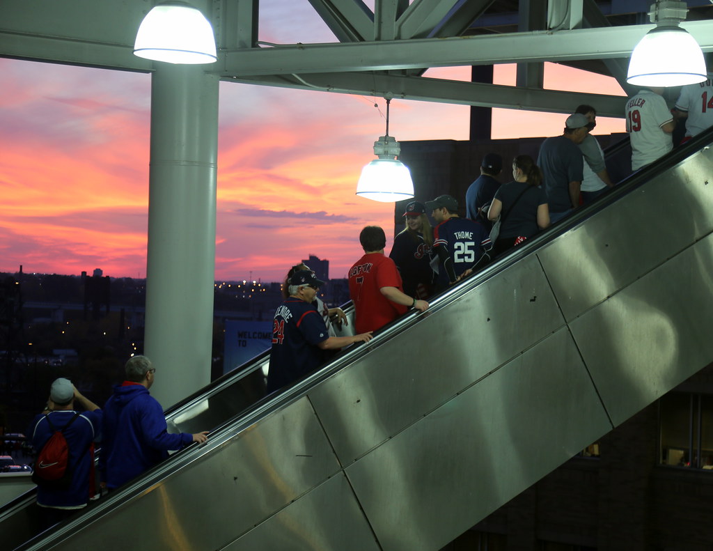 Fans make their way into Progressive Field as the sun sets… Flickr