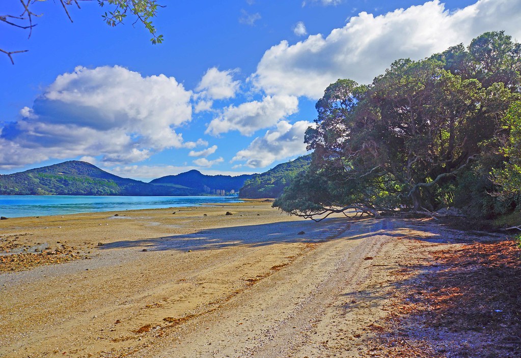 Beach at low tide with clouds At high tide this beach is a… Flickr