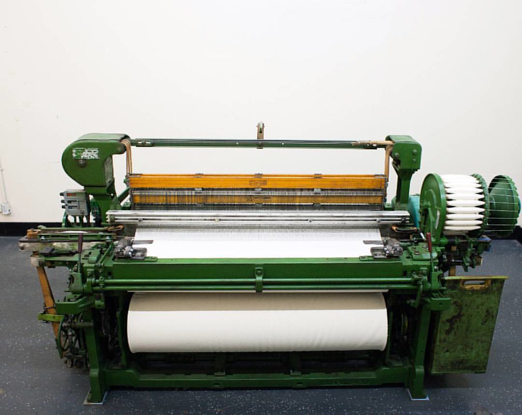 1962 Draper X3 loom. Weaving a 52" wide selvedge midweight… Flickr