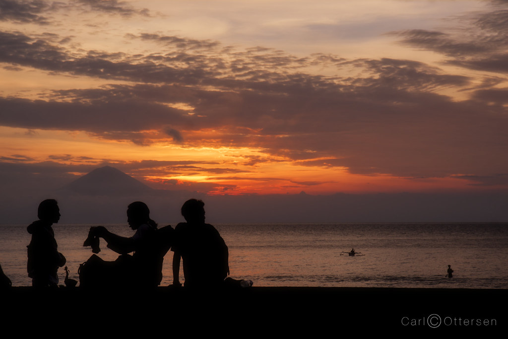 Beach traders in the sunset over the Lombok Strait. Flickr
