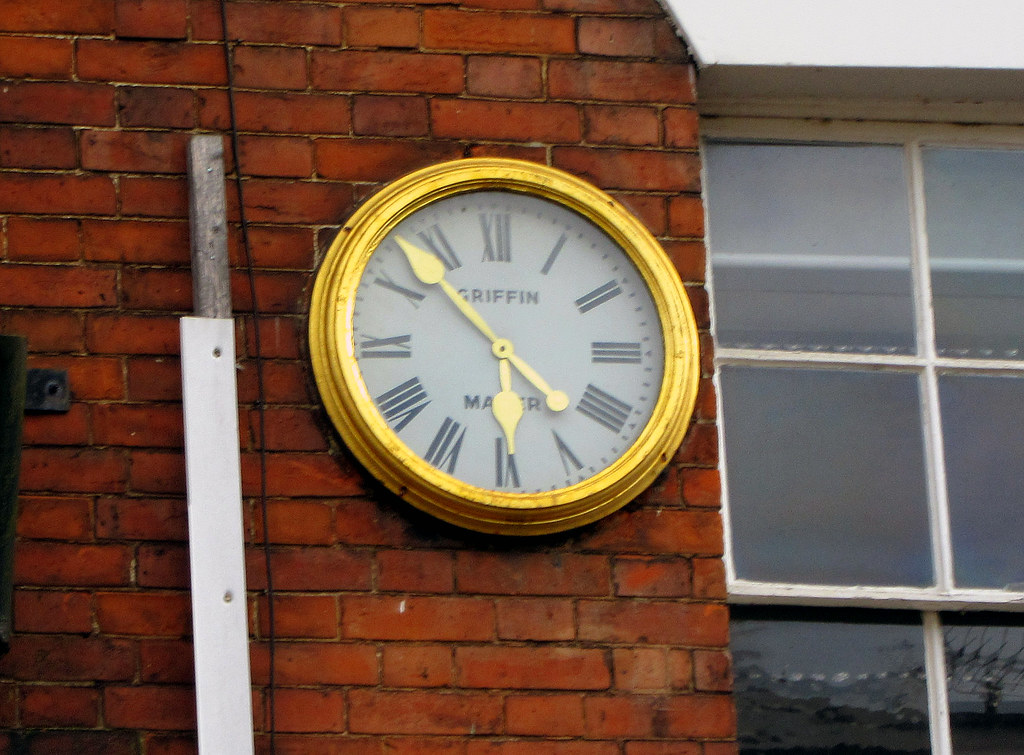 Wall Clock Tamworth. Clock on building wall above shops in… Flickr
