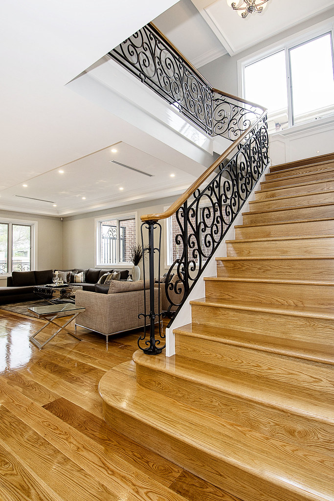 Classic "L" shaped Staircase with Wrought Iron Balustrade