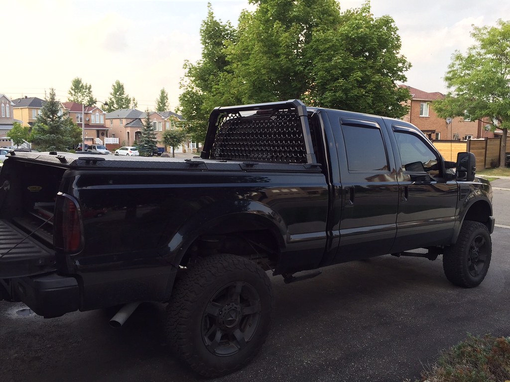 A Heavy Duty Tonneau Cover And Custom Headache Rack On A Ford Super