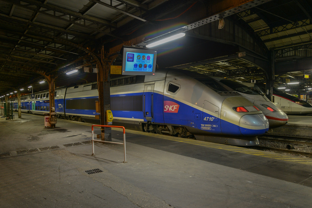 TGV trains at one of Paris train stations The TGV (French… Flickr
