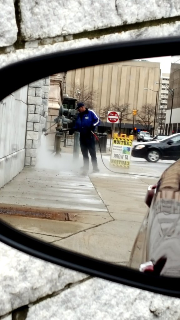 Rear view mirror Cleaning a public building in my rear vie… Flickr
