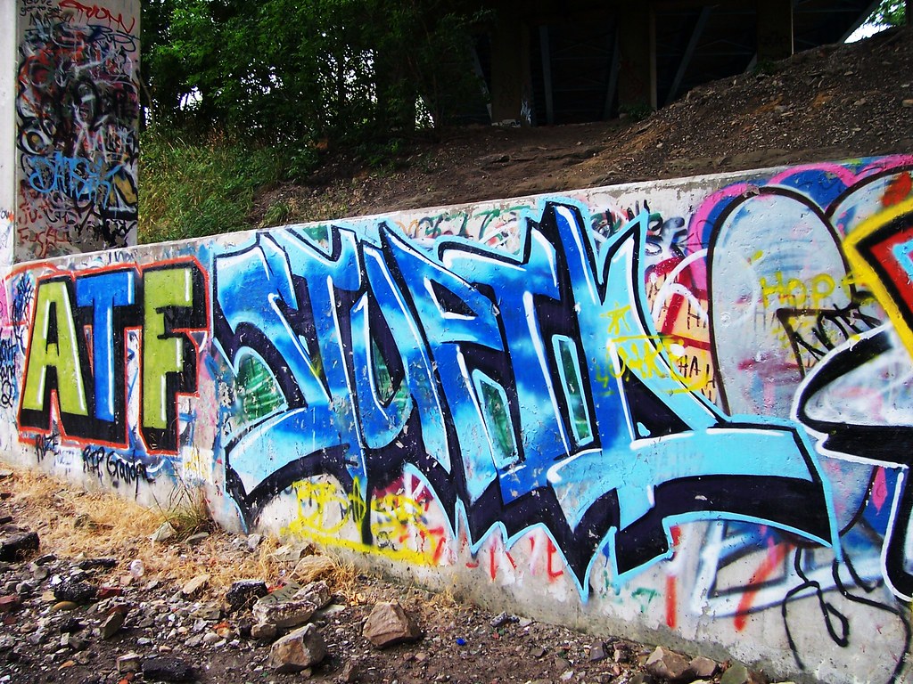 Kent Graffiti 5 Graffiti beneath a bridge in Kent, Ohio. The Upstairs Room Flickr