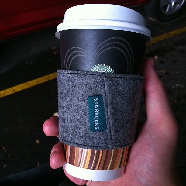 Gloria Jeans cup wrapped in Starbucks sleeve, hmm… Flickr