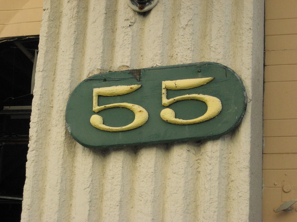 Wynn's Motors A hand painted street number sign for an aut… Flickr