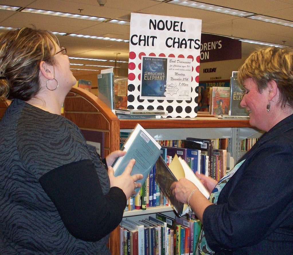 Mrs. Simon (right) helps a library user Wood County District Public Library Flickr
