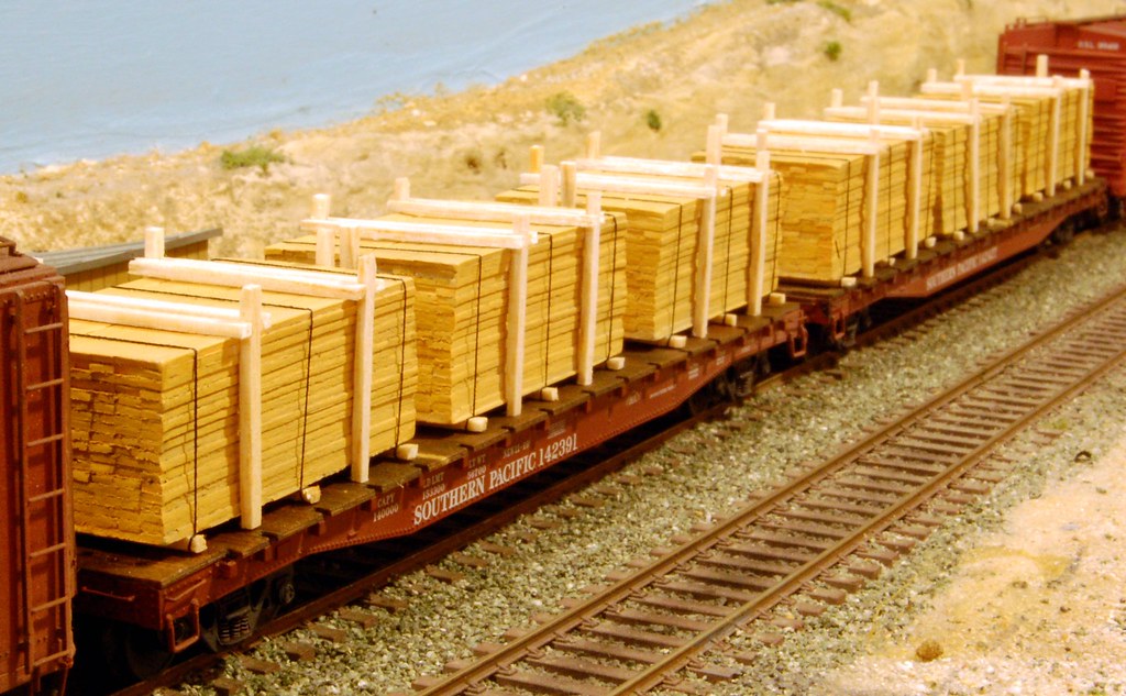 Lumber loads on two flat cars. Brian Moore Flickr
