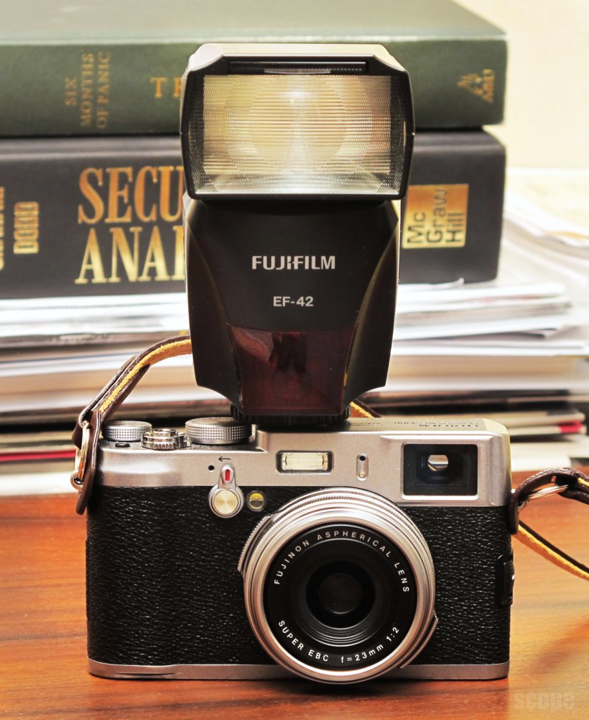 Fuji X100 and EF42 flash The Fuji X100 with the EF42 flash… Flickr